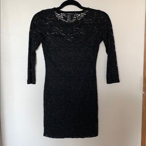 Black fitted cocktail dress with lace detail